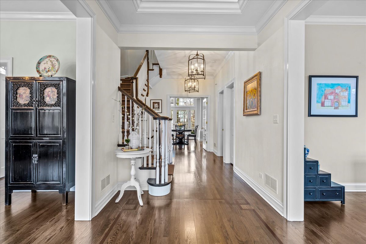 410 Cedar Street Winnetka, IL 60093 - Photo 2 of 57 a view of hallway with wooden floor and stairs