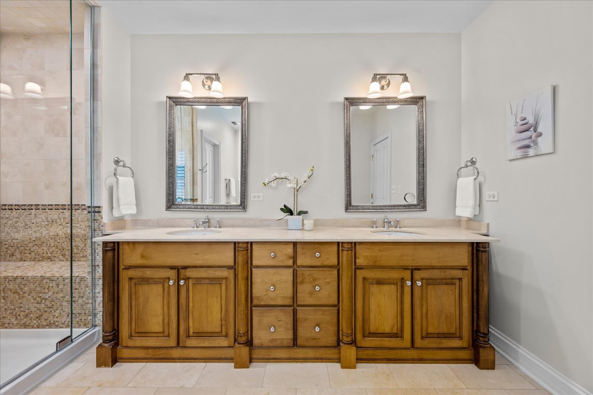 410 Cedar Street Winnetka, IL 60093 - Photo 29 of 57 a bathroom with a sink and a mirror