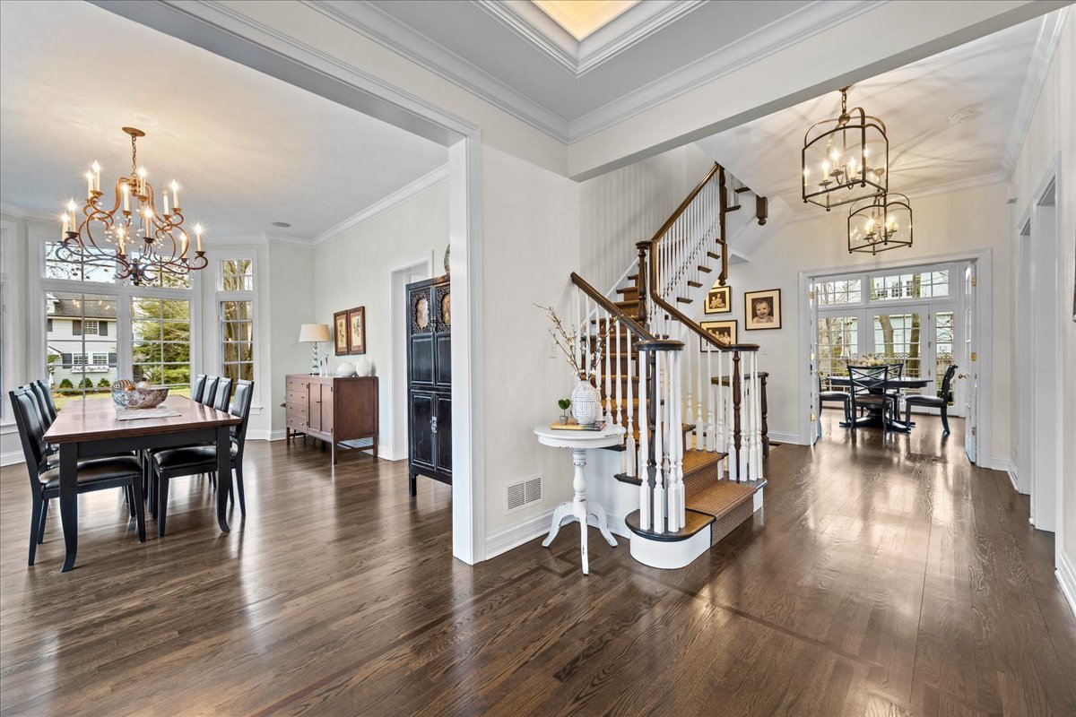 410 Cedar Street Winnetka, IL 60093 - Photo 3 of 57 a view of a livingroom with furniture wooden floor and a chandelier