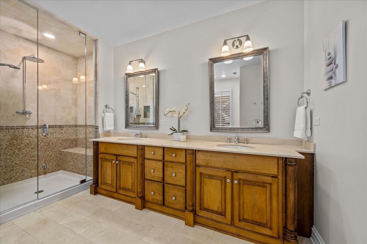 410 Cedar Street Winnetka, IL 60093 - Photo 31 of 57 a bathroom with a granite countertop sink mirror and double
