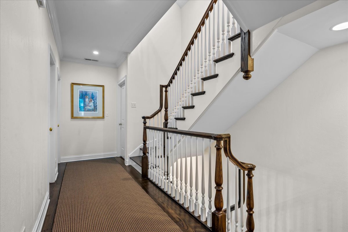 410 Cedar Street Winnetka, IL 60093 - Photo 34 of 57 a view of staircase with wooden floor and white walls