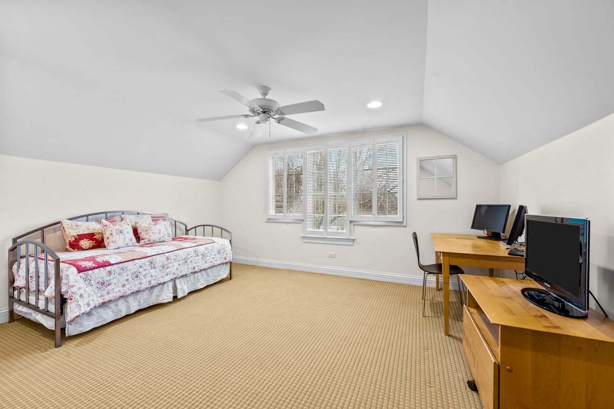410 Cedar Street Winnetka, IL 60093 - Photo 38 of 57 a very nice looking room with a bed and a large window