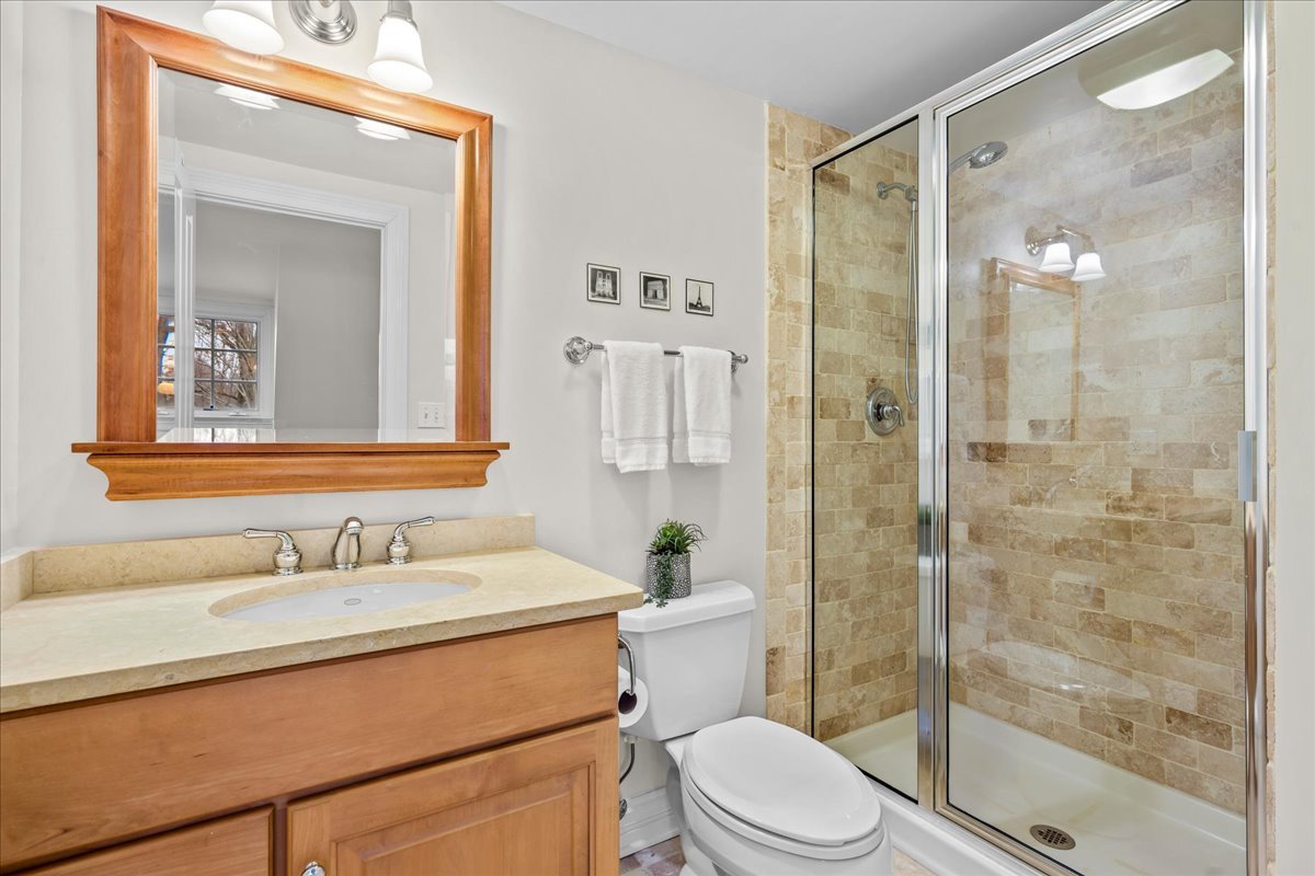 410 Cedar Street Winnetka, IL 60093 - Photo 39 of 57 a bathroom with a sink toilet and shower