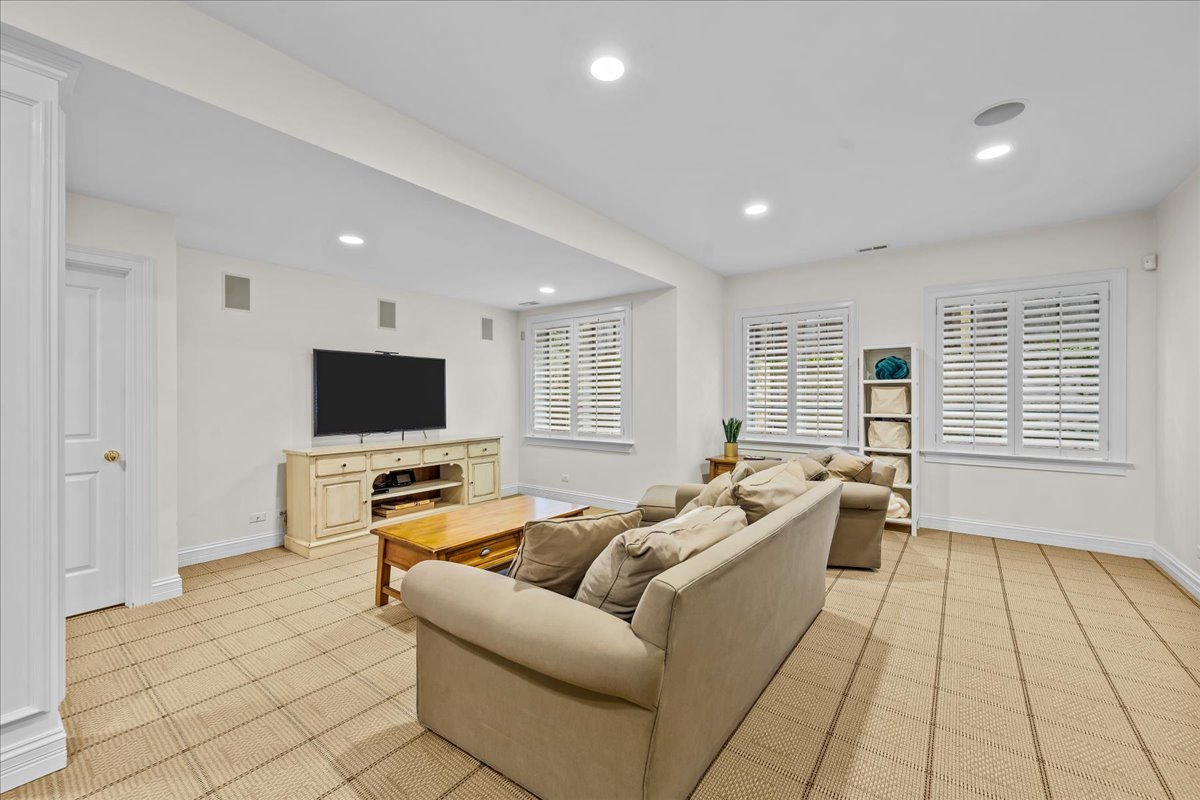 410 Cedar Street Winnetka, IL 60093 - Photo 41 of 57 a living room with furniture and a flat screen tv