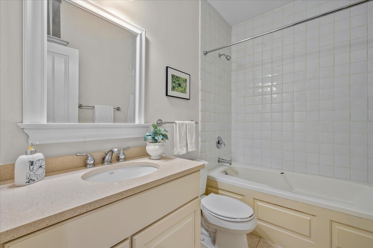410 Cedar Street Winnetka, IL 60093 - Photo 46 of 57 a bathroom with a granite countertop sink a toilet and shower