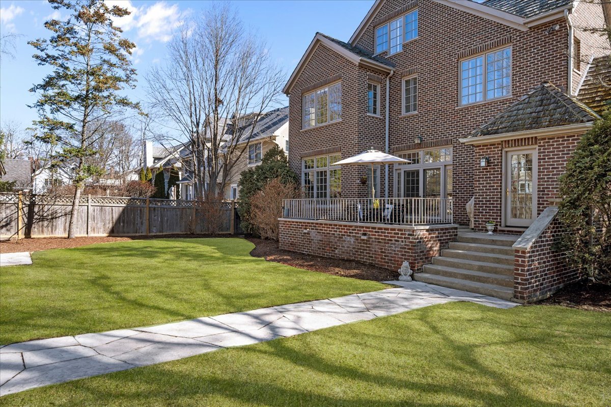 410 Cedar Street Winnetka, IL 60093 - Photo 47 of 57 a front view of a house with a yard