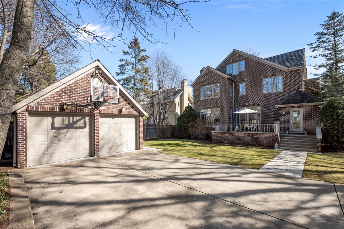 410 Cedar Street Winnetka, IL 60093 - Photo 52 of 57 a view of a house with a big yard and large trees