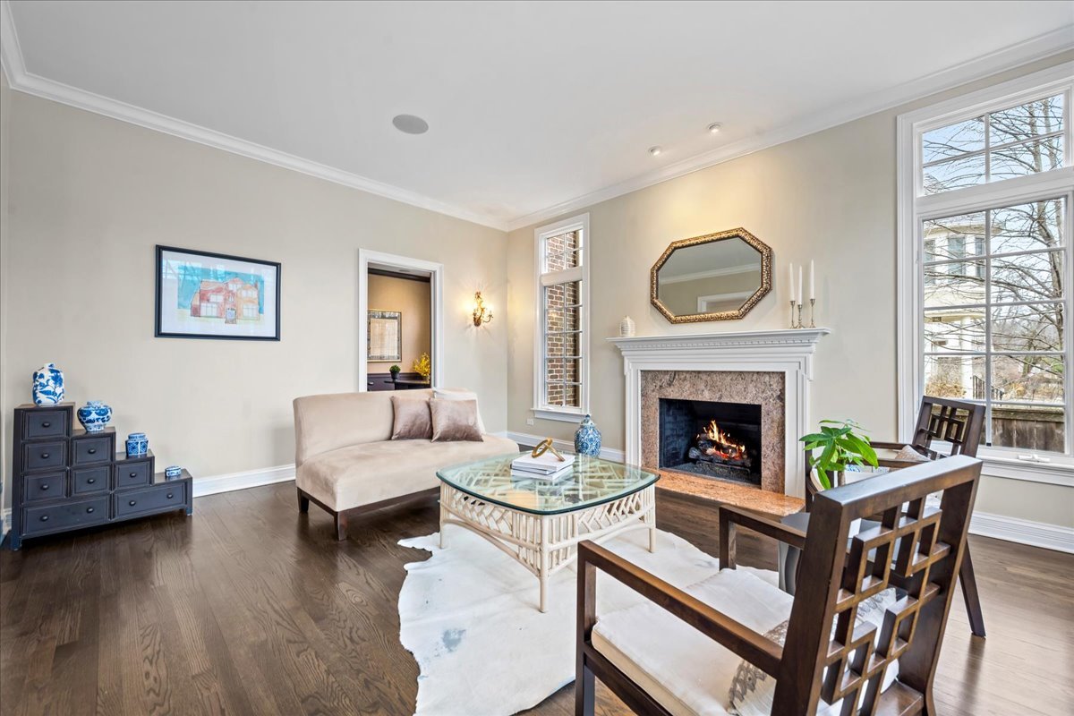 410 Cedar Street Winnetka, IL 60093 - Photo 9 of 57 a living room with furniture and a fireplace