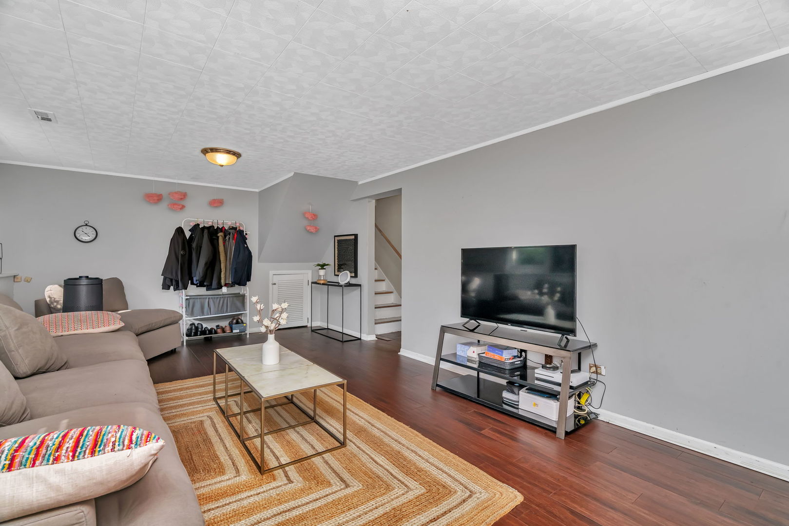 4217 Main Street Downers Grove, IL 60515 - Photo 18 of 31 a living room with furniture and a flat screen tv