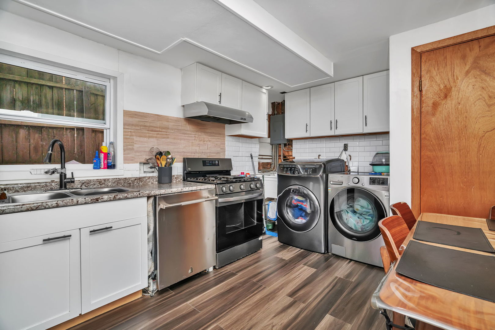 4217 Main Street Downers Grove, IL 60515 - Photo 19 of 31 a kitchen with stainless steel appliances a white stove top oven and sink