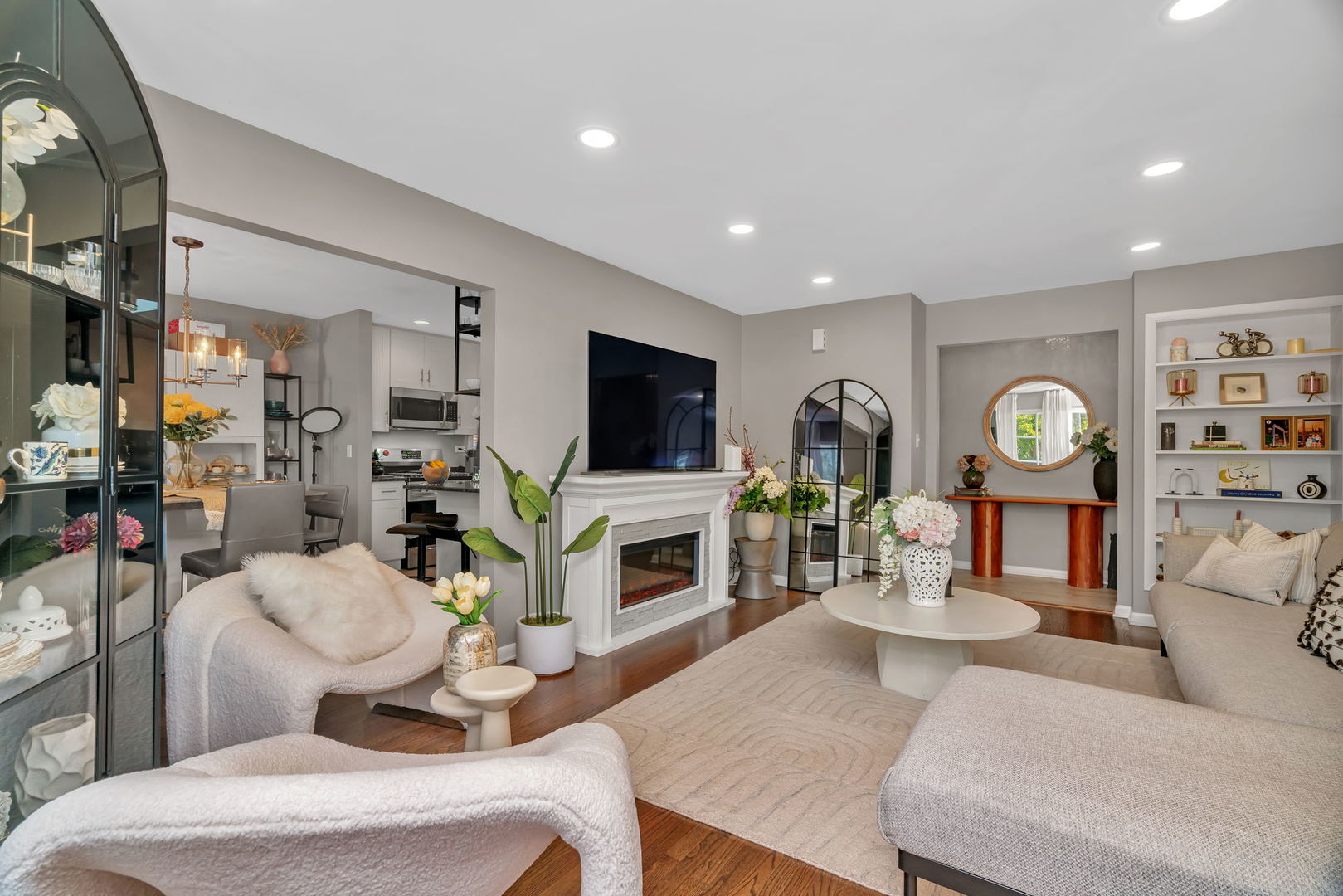 4217 Main Street Downers Grove, IL 60515 - Photo 4 of 31 a living room with furniture a flat screen tv and a fireplace