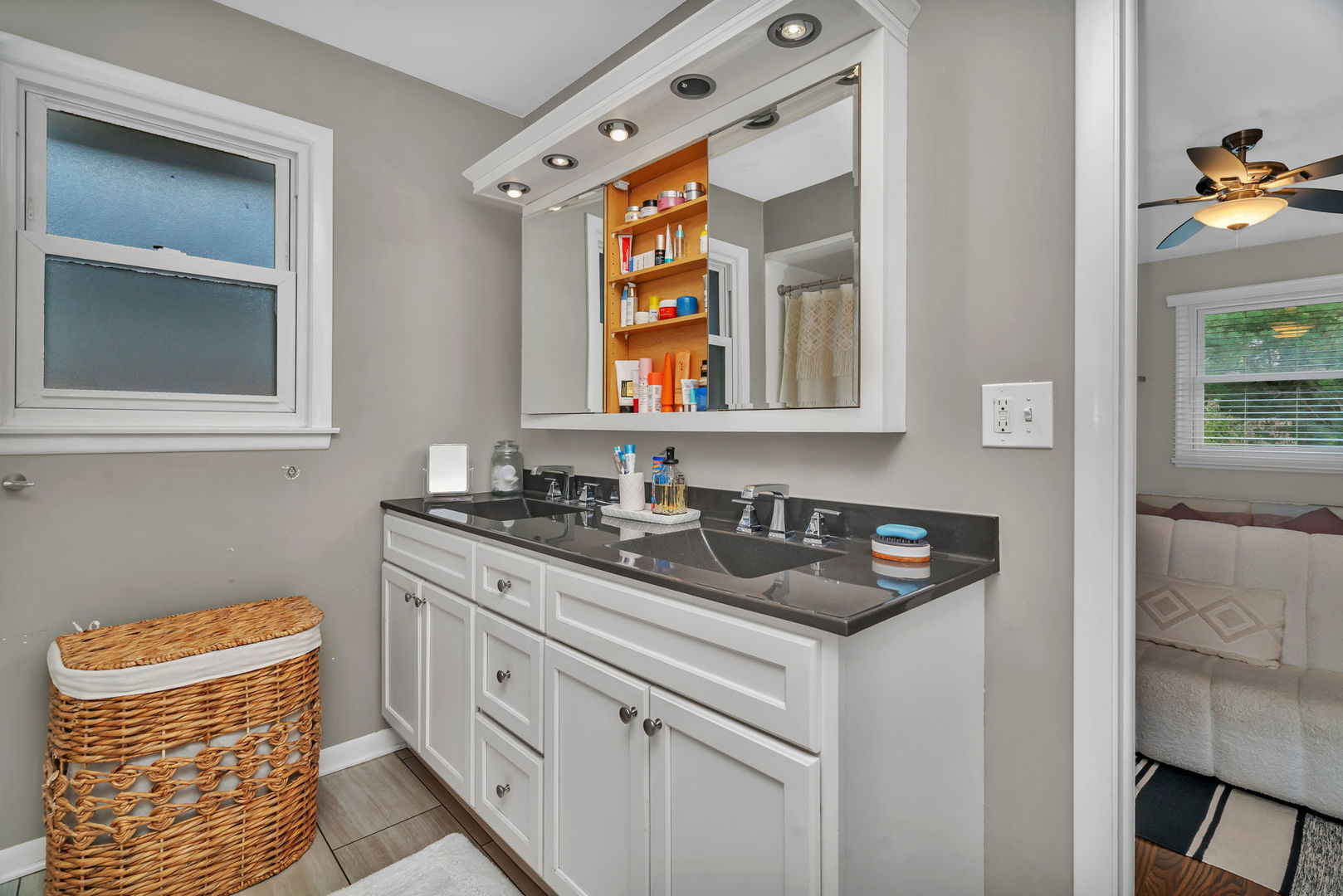 4217 Main Street Downers Grove, IL 60515 - Photo 10 of 31 a bathroom with a sink a vanity and a window