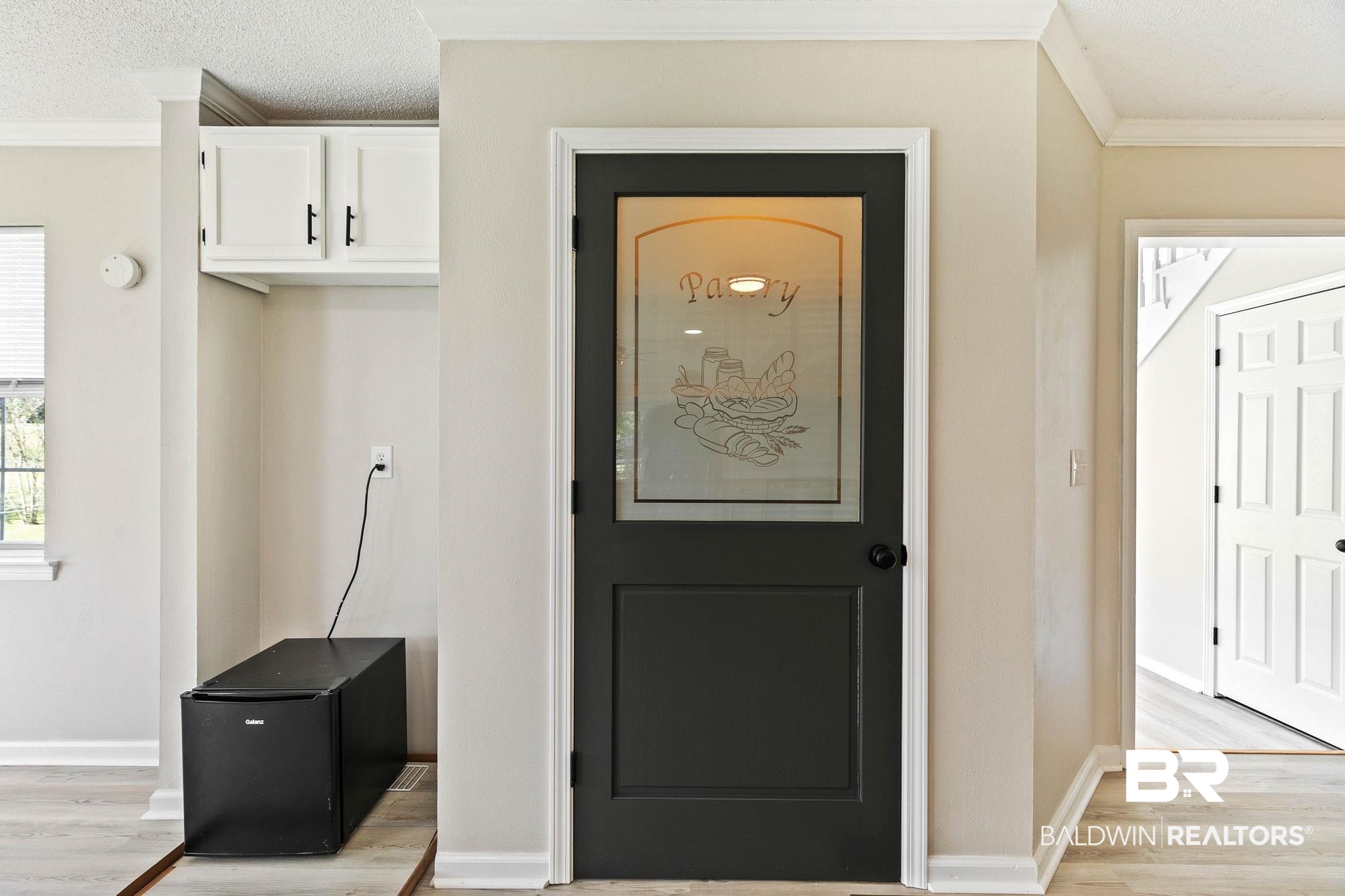 35650 Spring Road North Stapleton, AL 36578 - Photo 21 of 70 Interior space featuring ornamental molding, light wood-style flooring, and a textured ceiling
