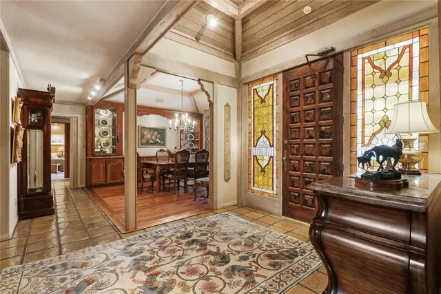 a view of a livingroom with furniture and a window