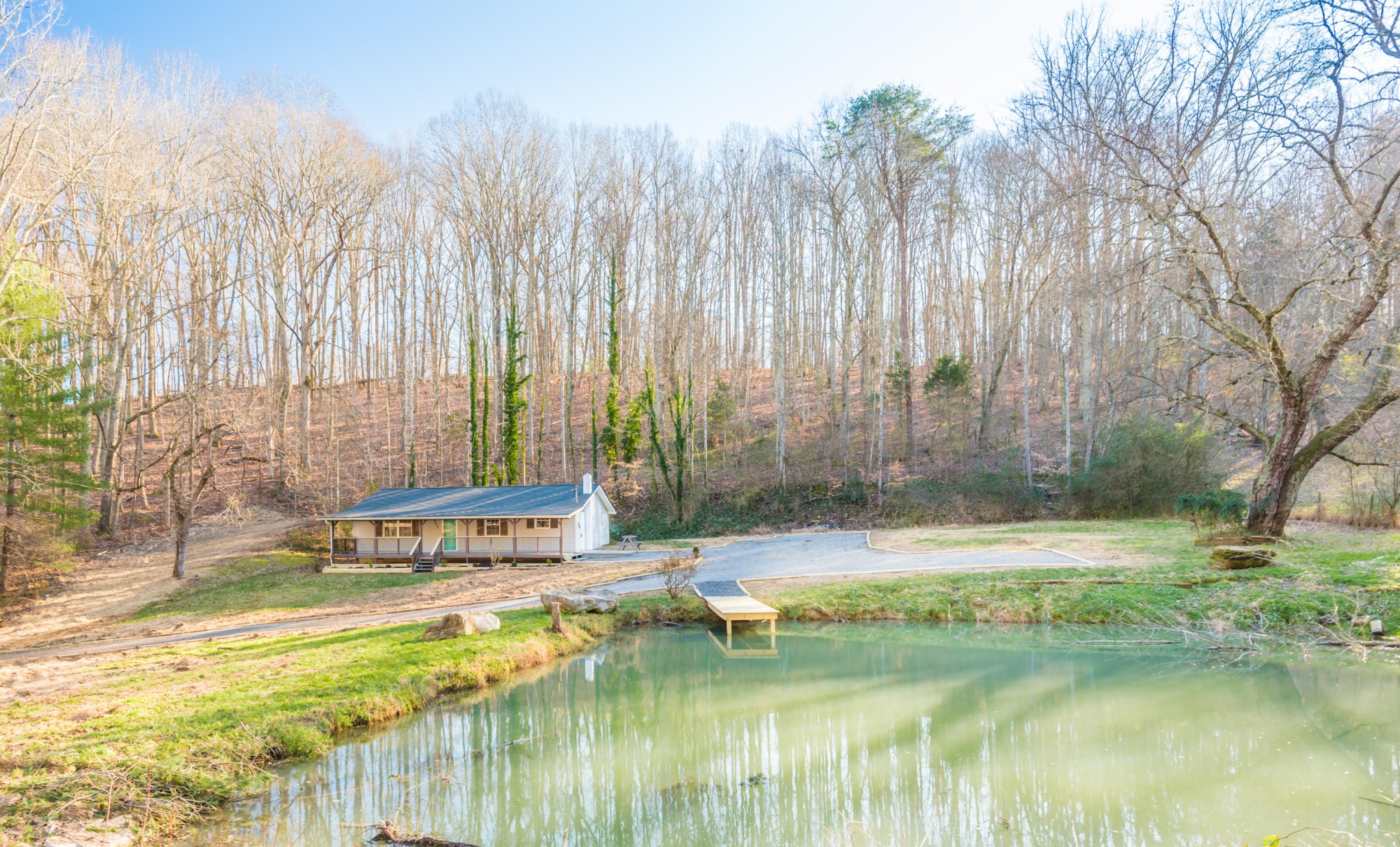 9825 Chestnut Ridge Road Heiskell, TN 37754 - Photo 1 of 32 a view of swimming pool with a yard and large trees