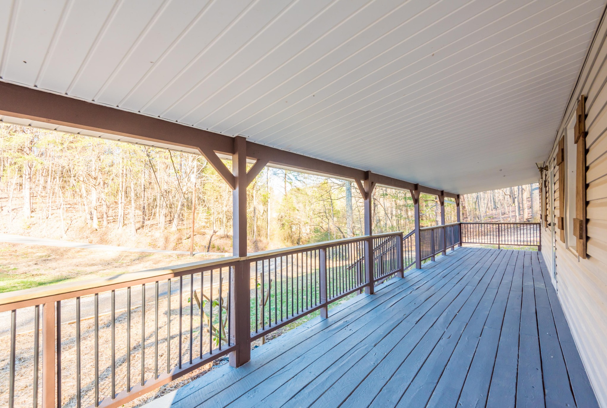 9825 Chestnut Ridge Road Heiskell, TN 37754 - Photo 25 of 32 a view of a porch with wooden floor