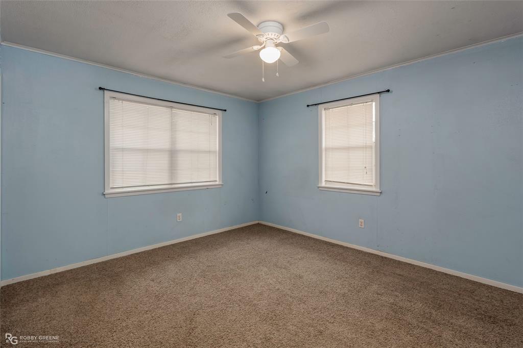 158 Edwards Road Doyline, LA 71023 - Photo 20 of 28 an empty room with a window and a fan