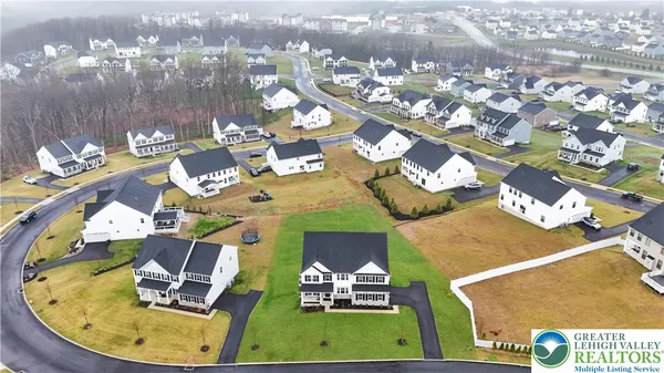 an aerial view of a house with swimming pool
