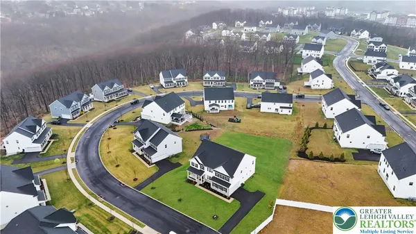 an aerial view of a house with outdoor space