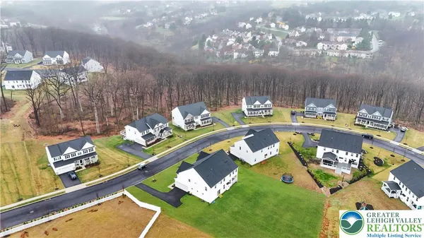 an aerial view of residential house with outdoor space and swimming pool