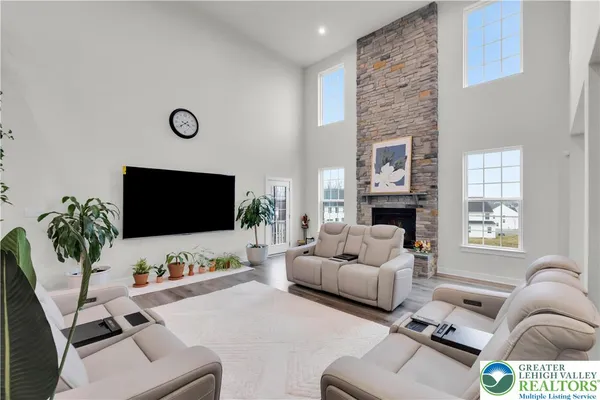 a kitchen with stainless steel appliances kitchen island granite countertop a sink counter top space cabinets and wooden floor