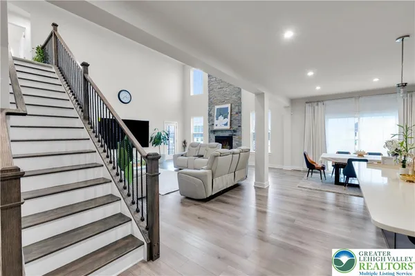 a kitchen with kitchen island granite countertop a sink a counter top space stainless steel appliances and cabinets
