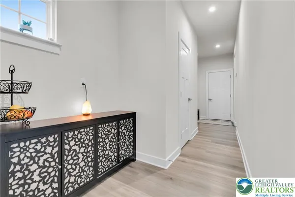 a kitchen with a refrigerator and cabinets