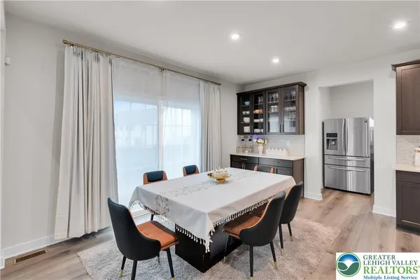 a bedroom with a bed and a table in it