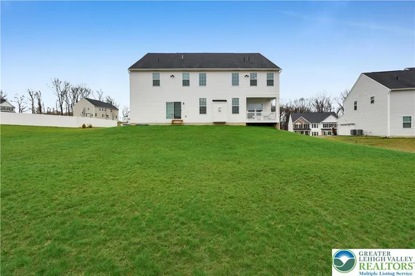 a view of a house with a big yard