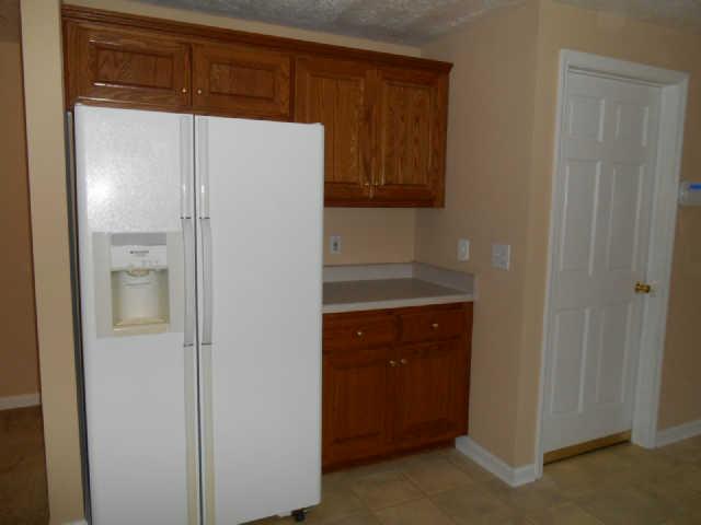 3101 Curd Road Mount Juliet, TN 37122 - Photo 5 of 19 Opposite side of kitchen. More deep solid oak cabinets. Door on right leads to basement.