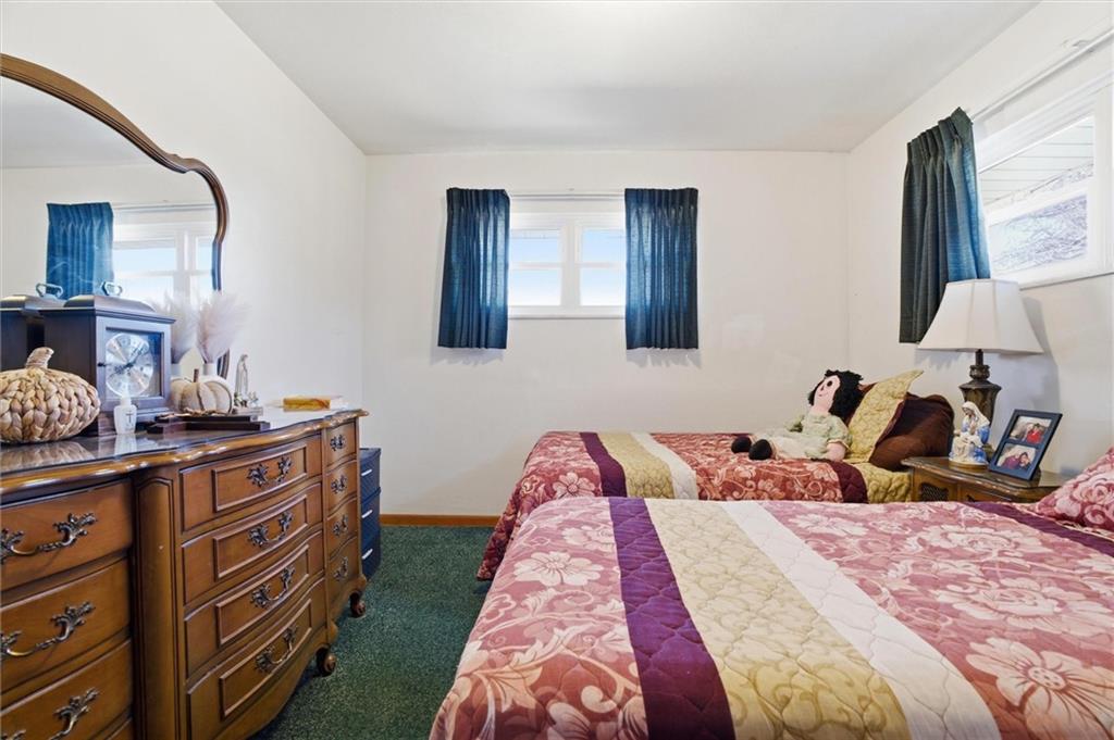 908 15th Street Elizabeth, PA 15037 - Photo 23 of 47 a bed room with a bed and a lamp