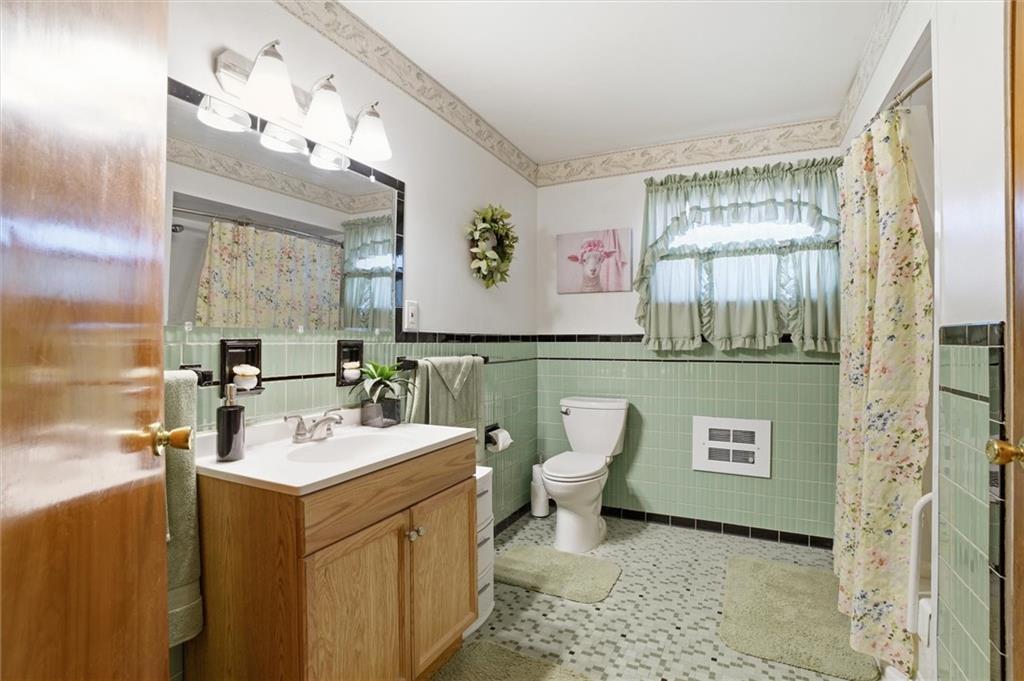 908 15th Street Elizabeth, PA 15037 - Photo 24 of 47 a bathroom with a toilet sink and mirror