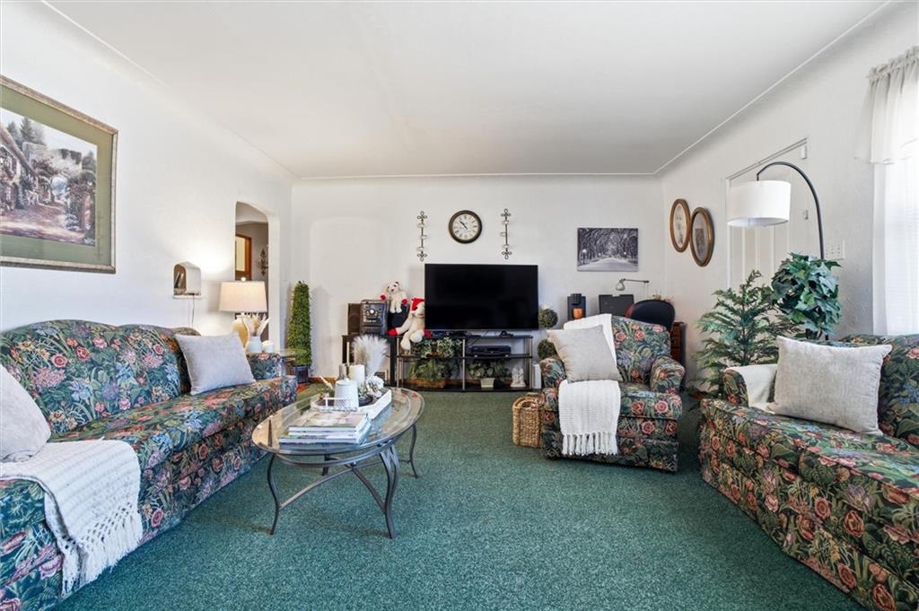 908 15th Street Elizabeth, PA 15037 - Photo 5 of 47 a living room with furniture a flat screen tv and a fireplace
