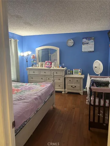 a bedroom with a bed and lamp