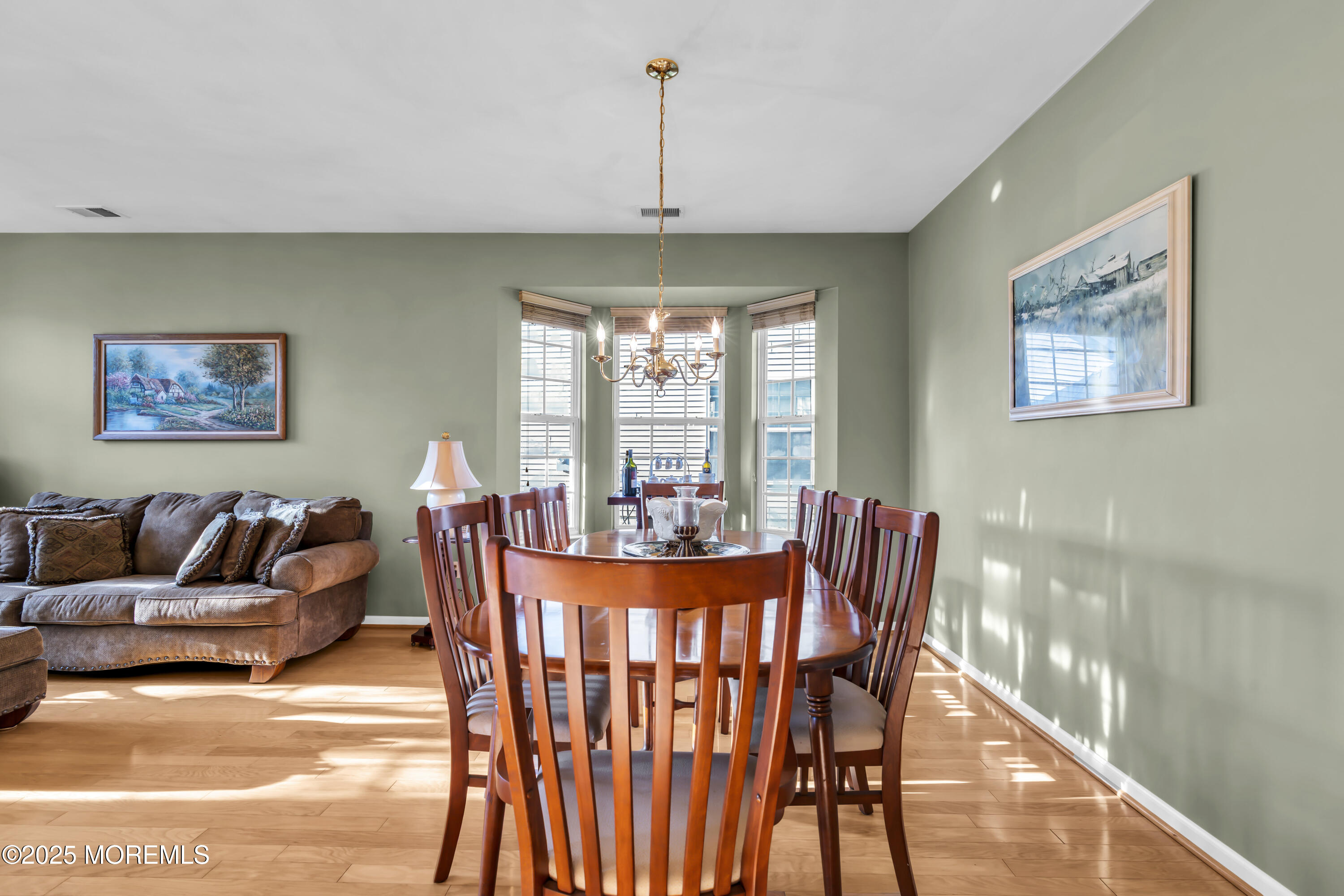 57 Hatteras Way Barnegat, NJ 08005 - Photo 11 of 60 a living room with furniture and a chandelier