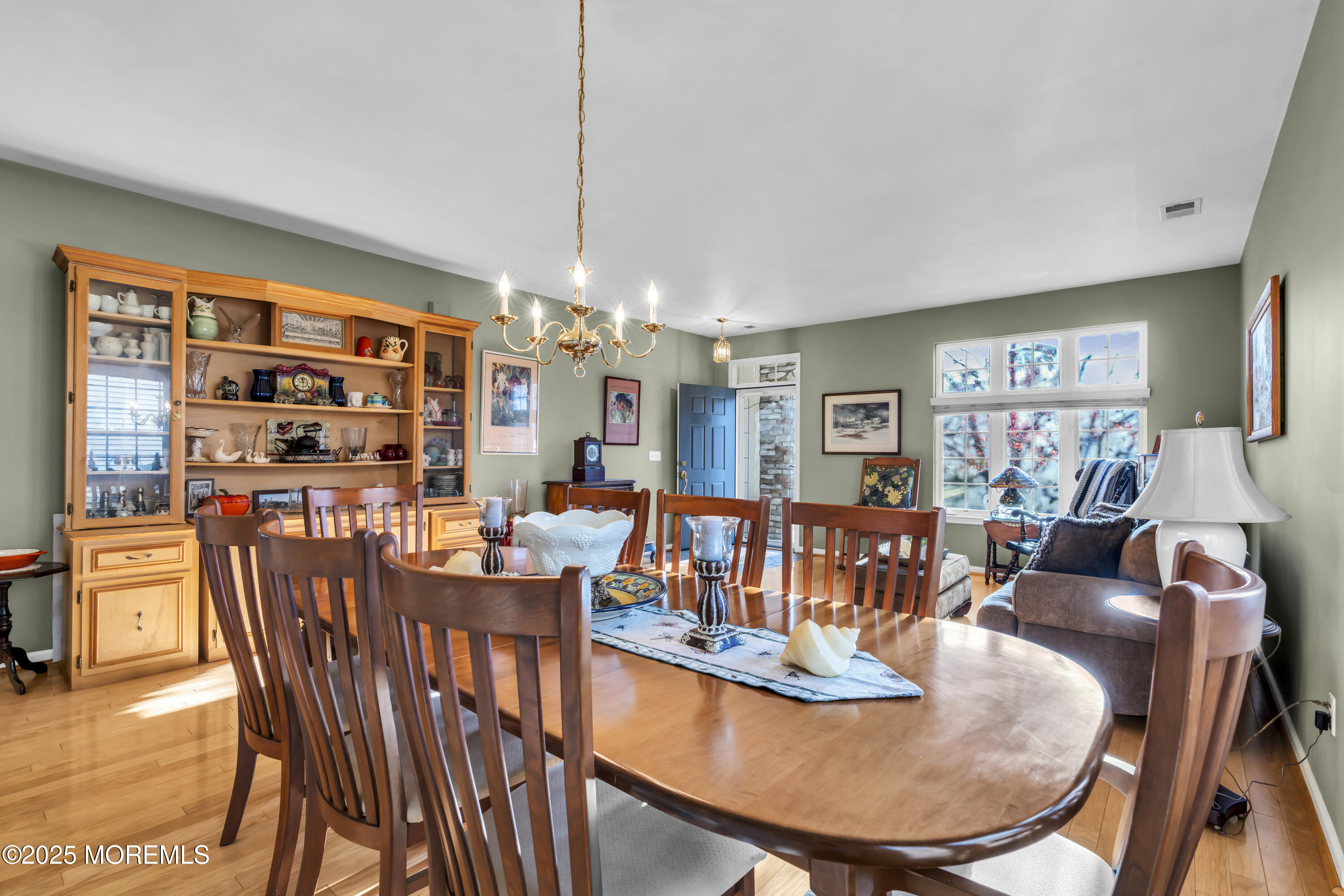 57 Hatteras Way Barnegat, NJ 08005 - Photo 14 of 60 a dining room with furniture a rug and wooden floor