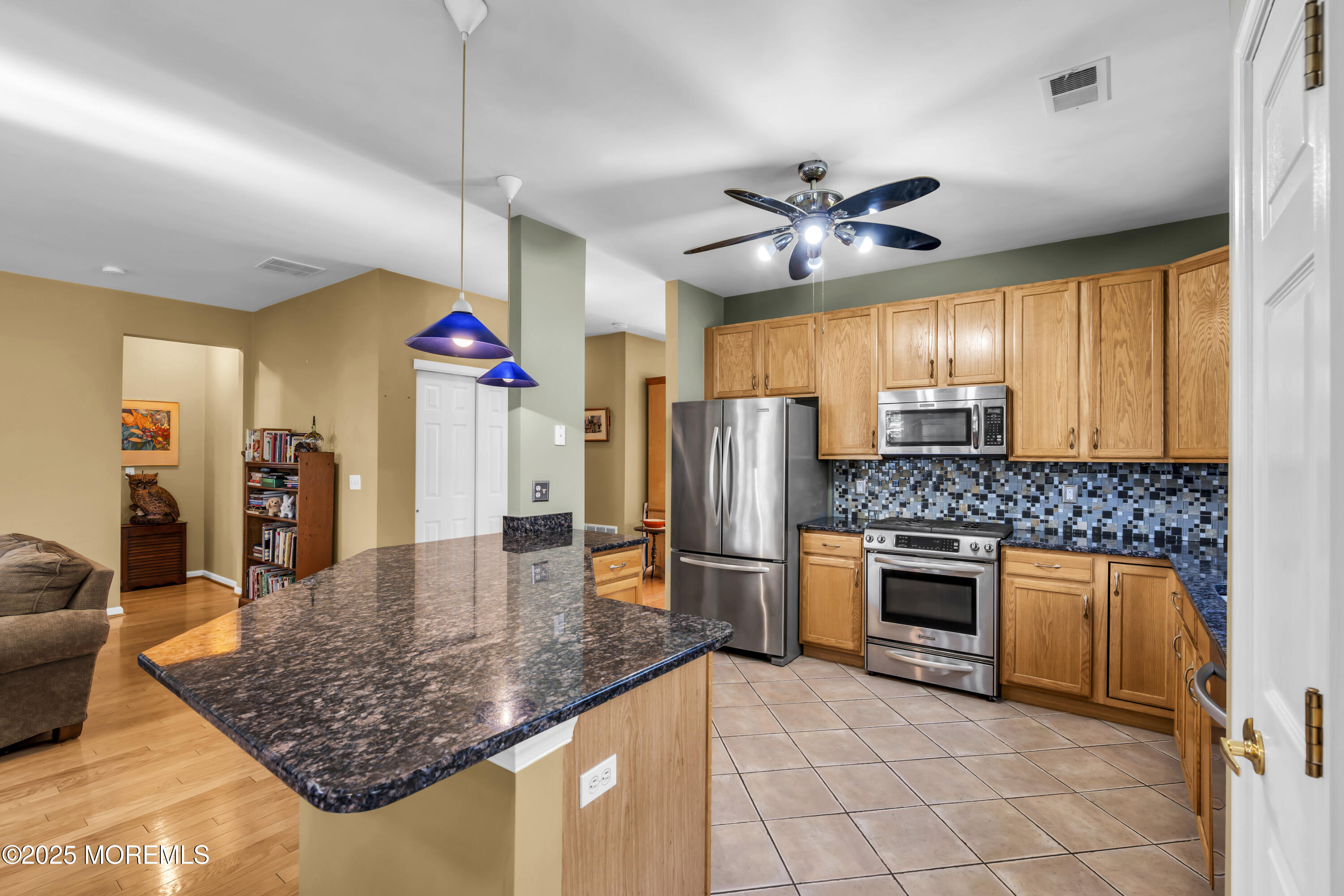 57 Hatteras Way Barnegat, NJ 08005 - Photo 23 of 60 a kitchen with stainless steel appliances granite countertop a sink a stove and a refrigerator