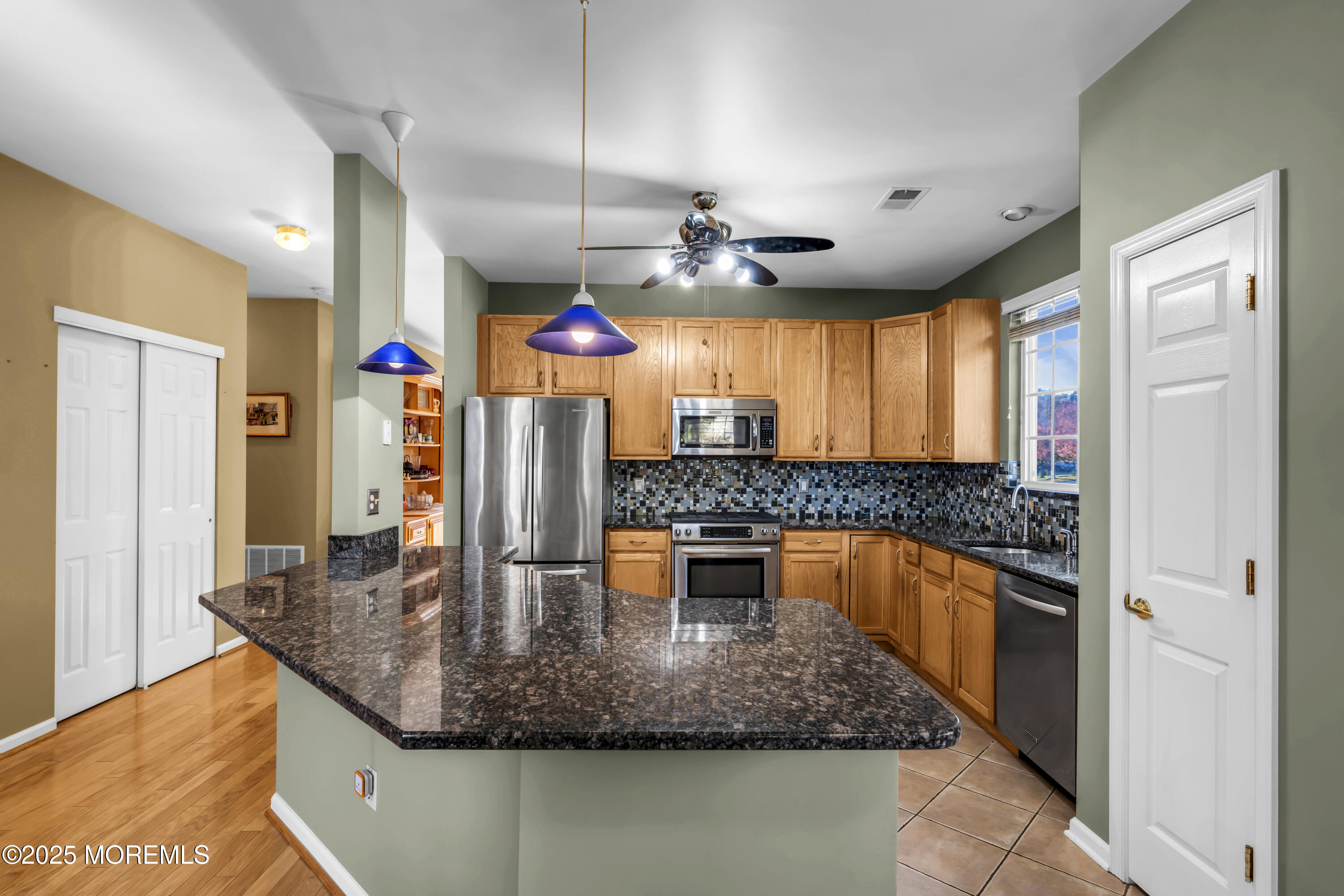 57 Hatteras Way Barnegat, NJ 08005 - Photo 24 of 60 a kitchen with stainless steel appliances granite countertop a sink a stove and a refrigerator
