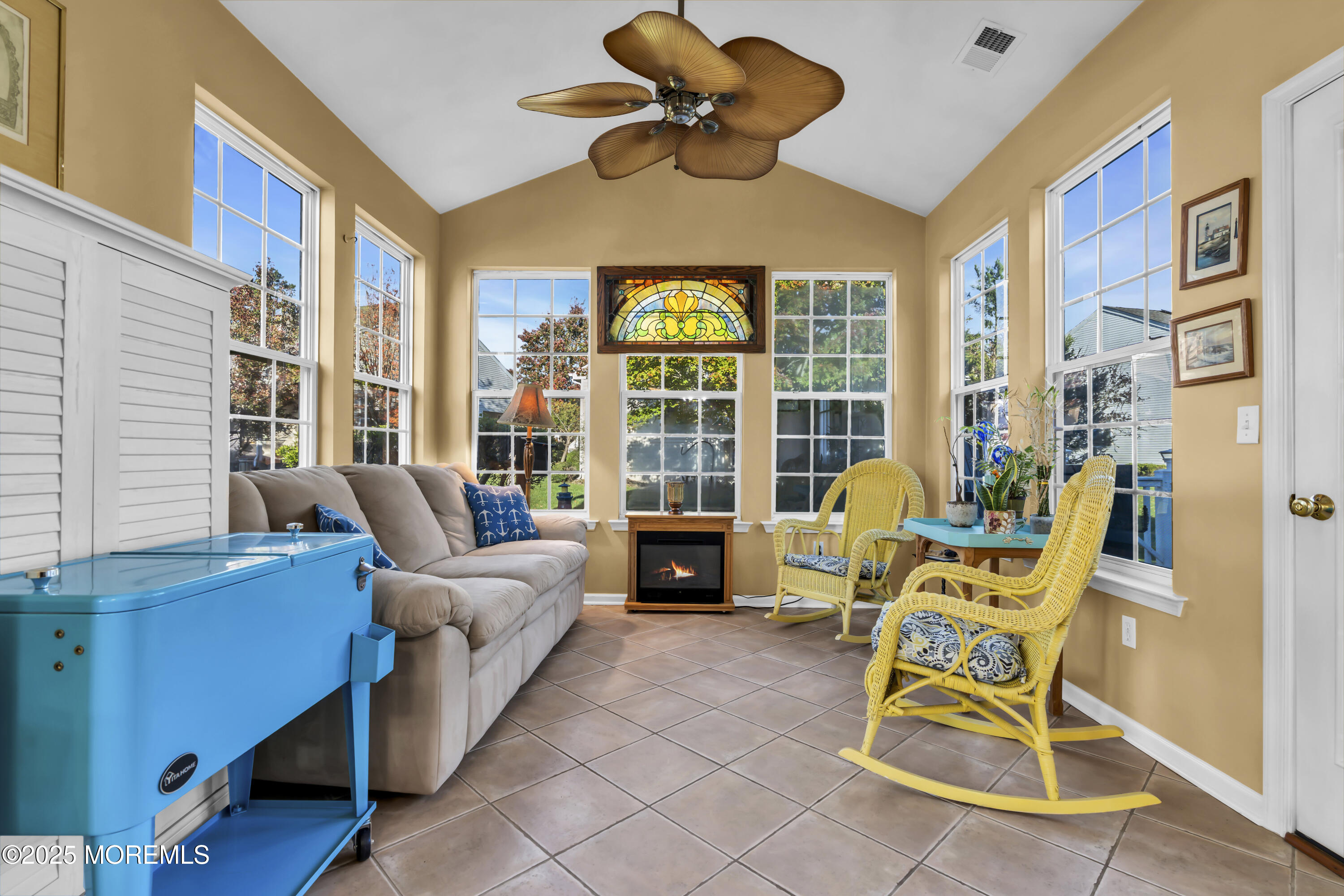 57 Hatteras Way Barnegat, NJ 08005 - Photo 28 of 60 a living room with furniture gym equipment and a large window