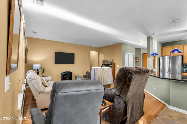 a view of bathroom with shower and mirror