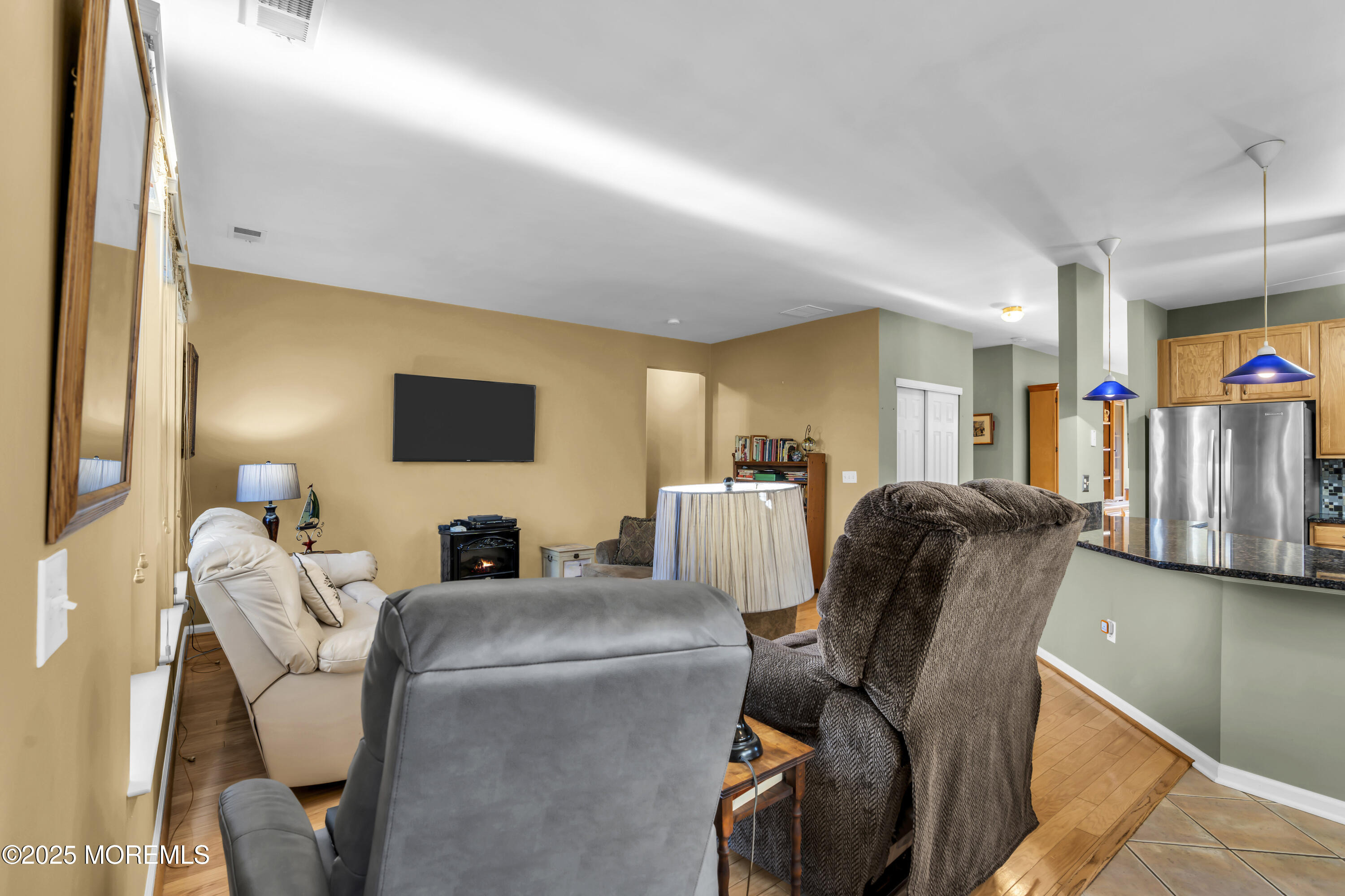 57 Hatteras Way Barnegat, NJ 08005 - Photo 33 of 60 a living room with furniture and a flat screen tv