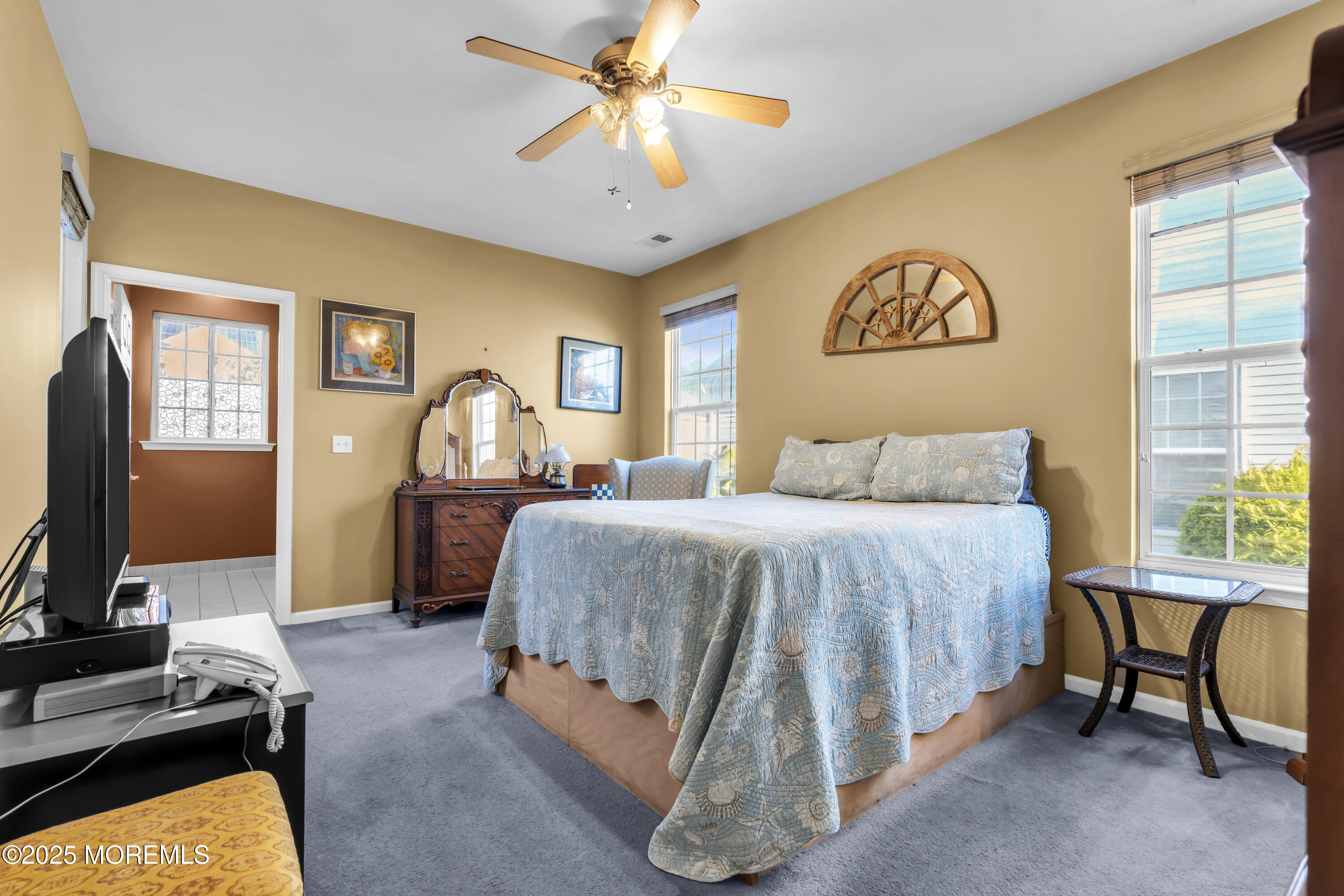 57 Hatteras Way Barnegat, NJ 08005 - Photo 40 of 60 a bedroom with a bed and a flat screen tv