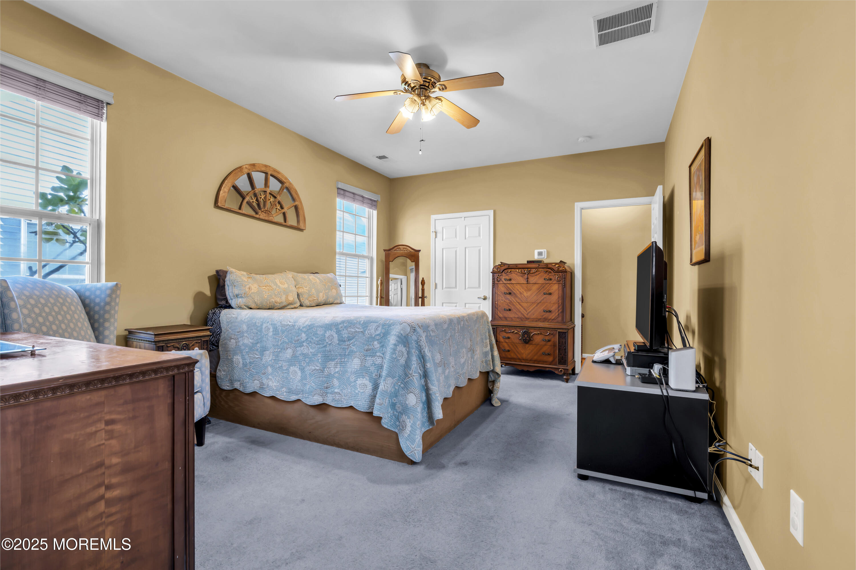 57 Hatteras Way Barnegat, NJ 08005 - Photo 41 of 60 a bedroom with a bed and a chandelier