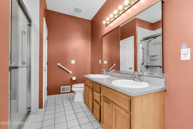 a view of a dining room and livingroom with furniture wooden floor a chandelier