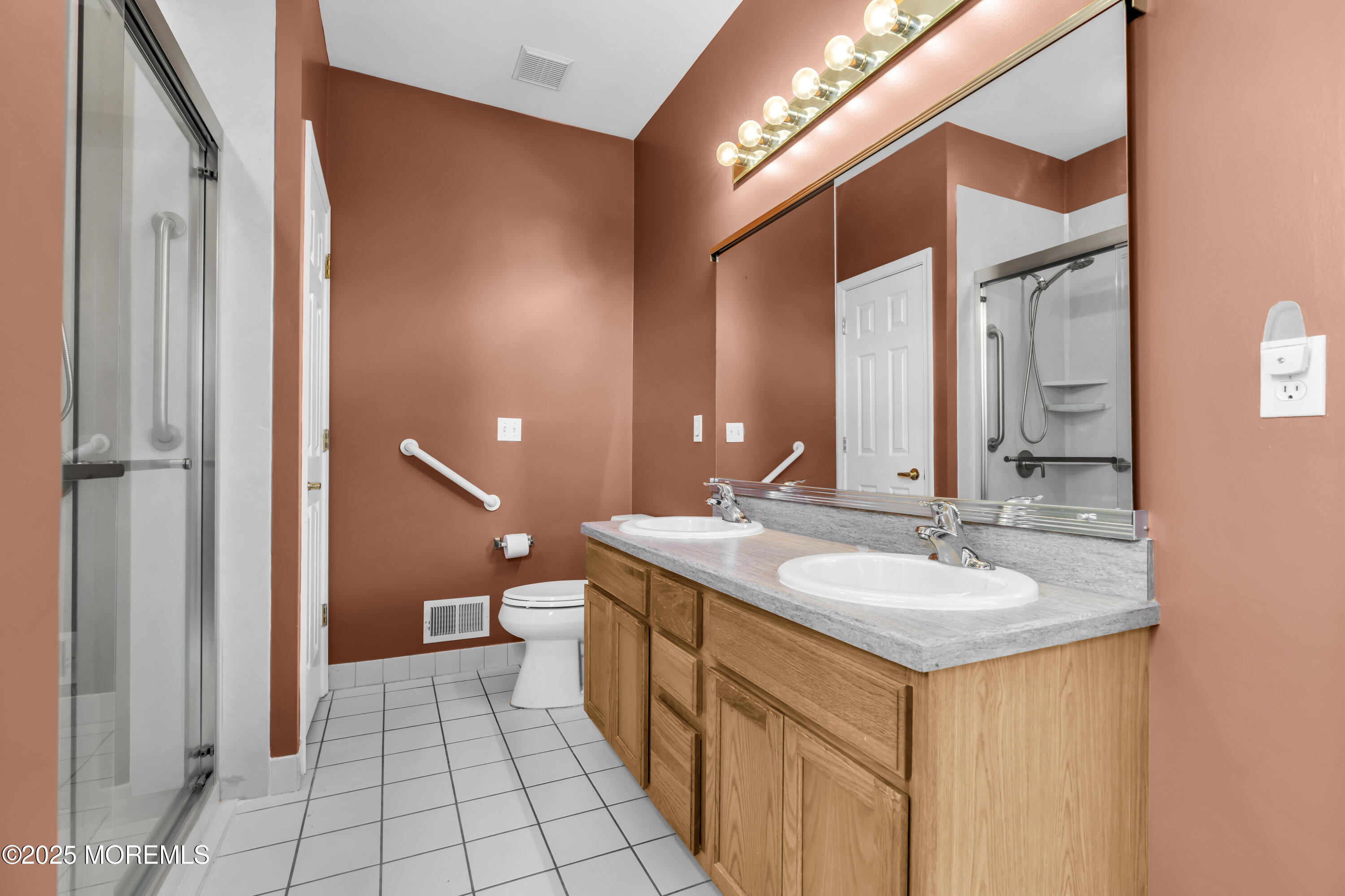 57 Hatteras Way Barnegat, NJ 08005 - Photo 43 of 60 a spacious bathroom with a double vanity sink and a mirror