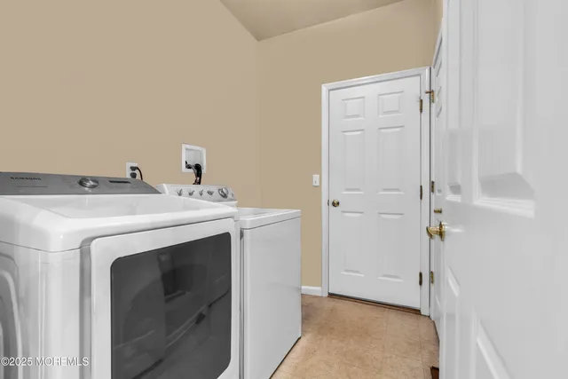 a living room with furniture ceiling fan and a large window