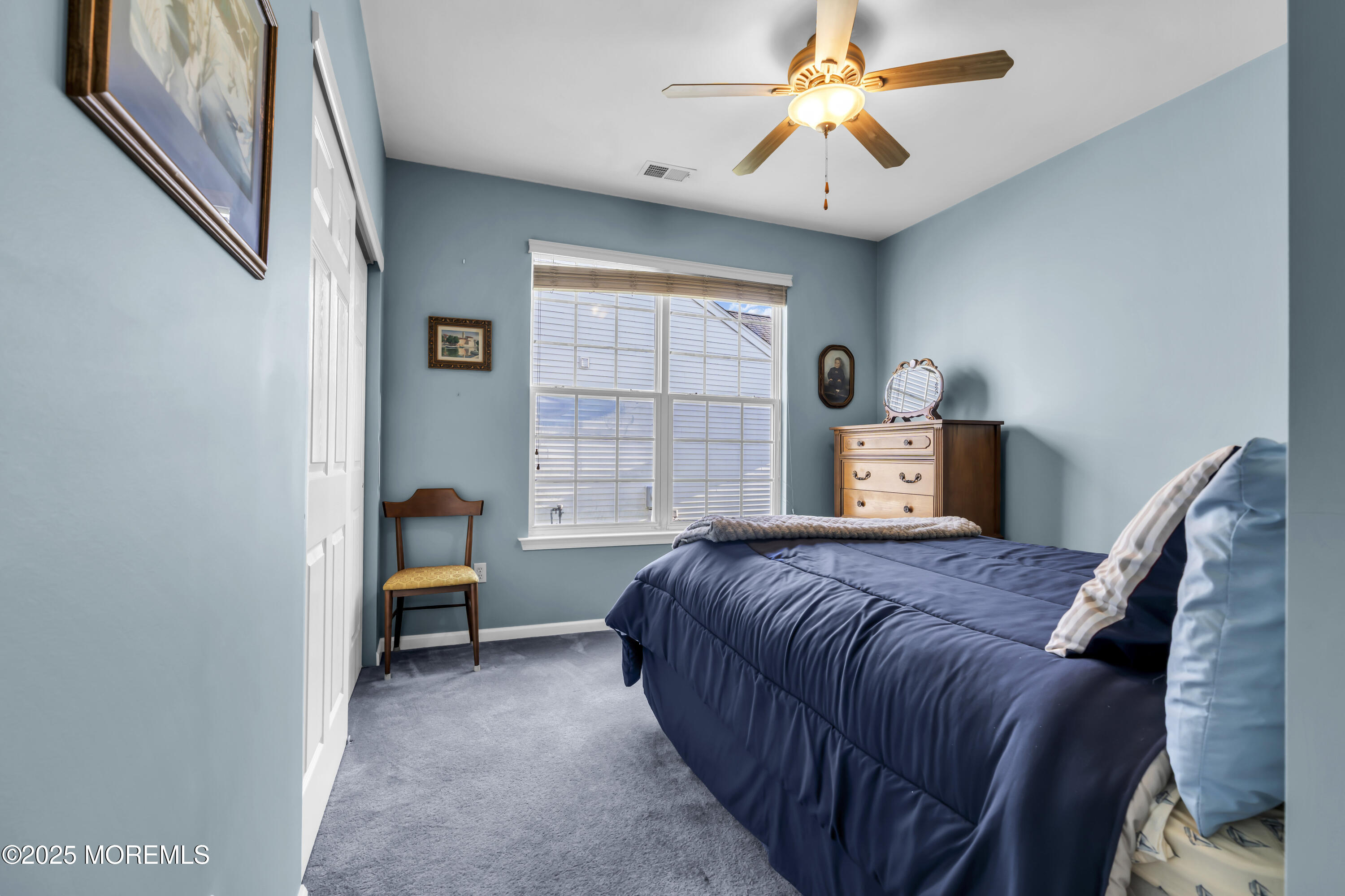 57 Hatteras Way Barnegat, NJ 08005 - Photo 45 of 60 a bedroom with a bed and a chandelier