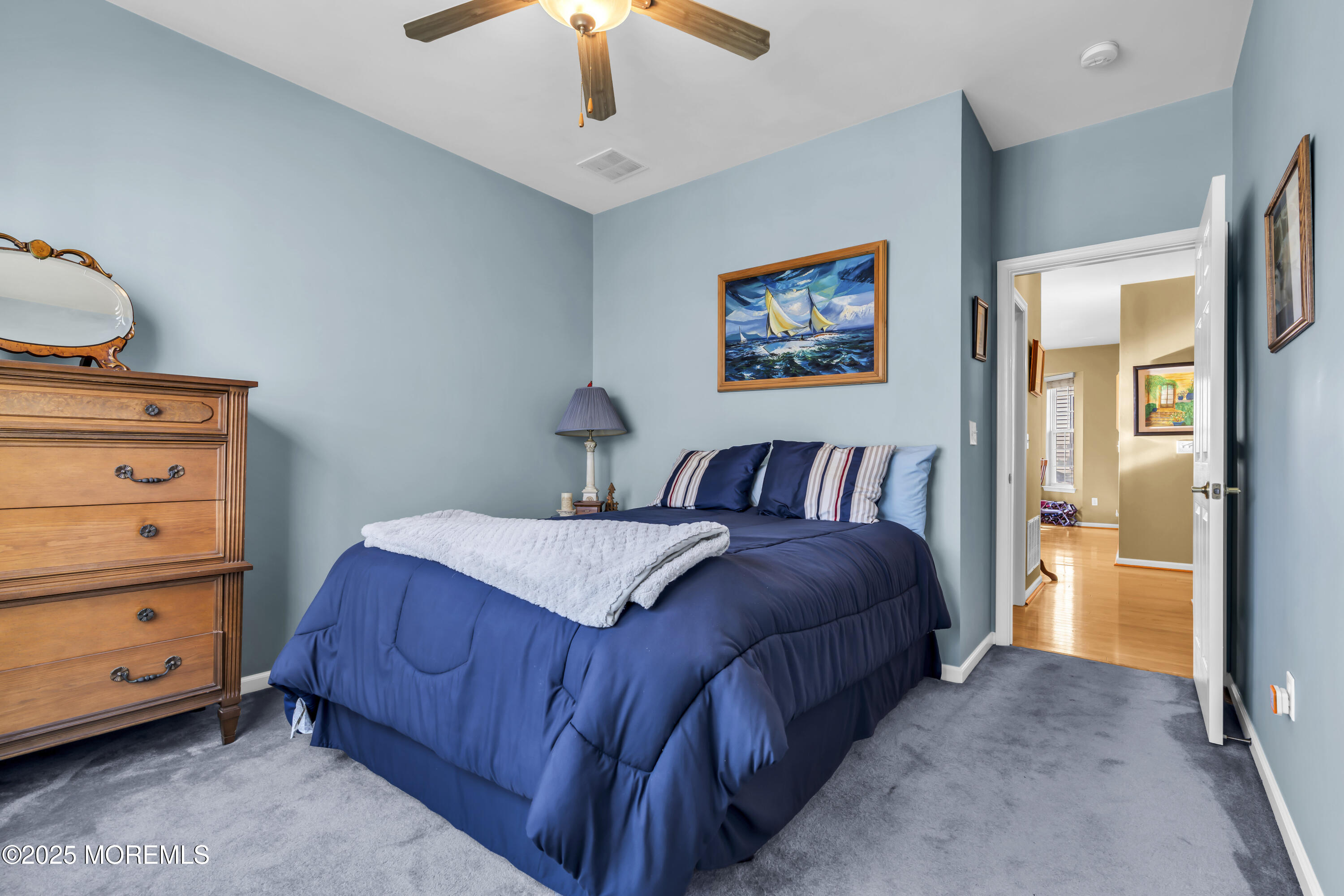 57 Hatteras Way Barnegat, NJ 08005 - Photo 46 of 60 a bedroom with a bed and a chandelier