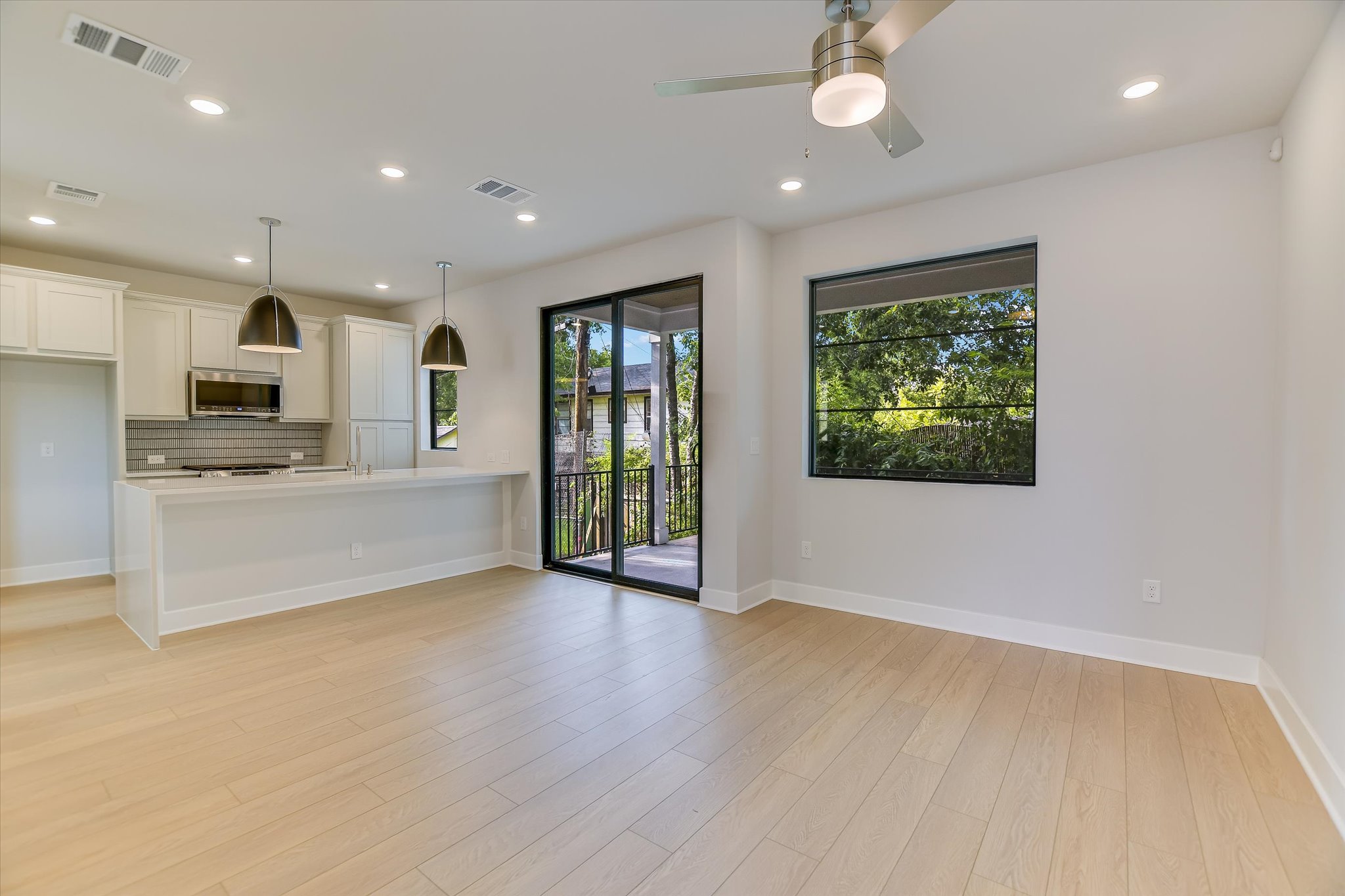 114 Lightsey Road, Unit 2 Austin, TX 78704 - Photo 3 of 14 Unfurnished living room featuring recessed lighting, light wood-style flooring, and ceiling fan