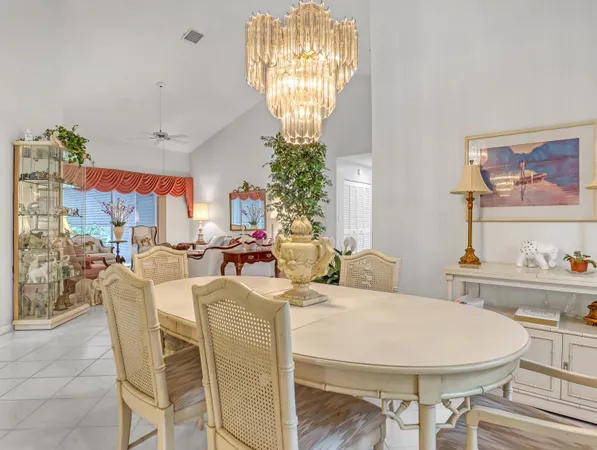 a living room with furniture and lamp